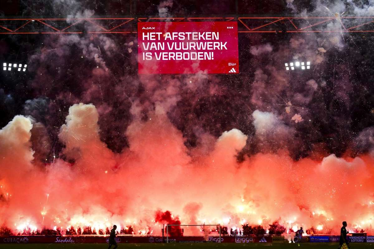 Eredivisie clash between Ajax and FC Groningen abandoned after fireworks halted play